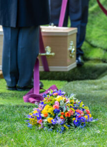 A Close-Up Image Of A Wreath At A Funeral Service